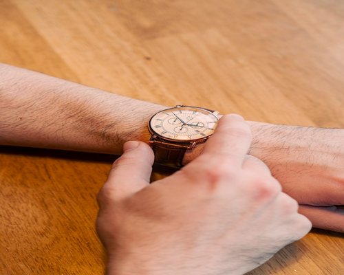 Watch on a wrist showing time